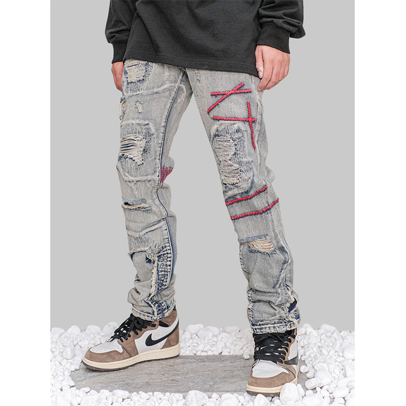 Men's Retro Distressed And Embroidered Jeans Model Photo