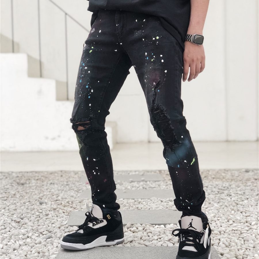 Men's Black Distressed Knee Paint Splatter Jeans Model Photo